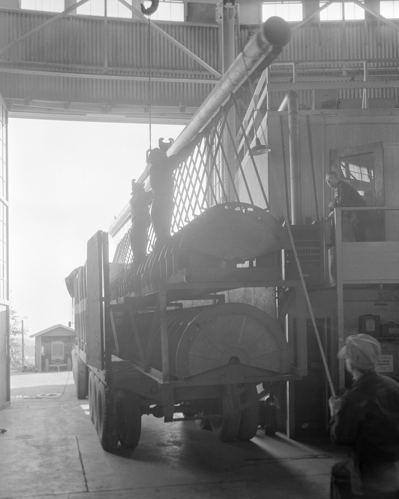 Arrival of 40-foot tank liner (on truck.) Photograph taken December 27, 1946. LINAC-312 - DPLA - 8429e27070f369f37a906a508fcccd1f
