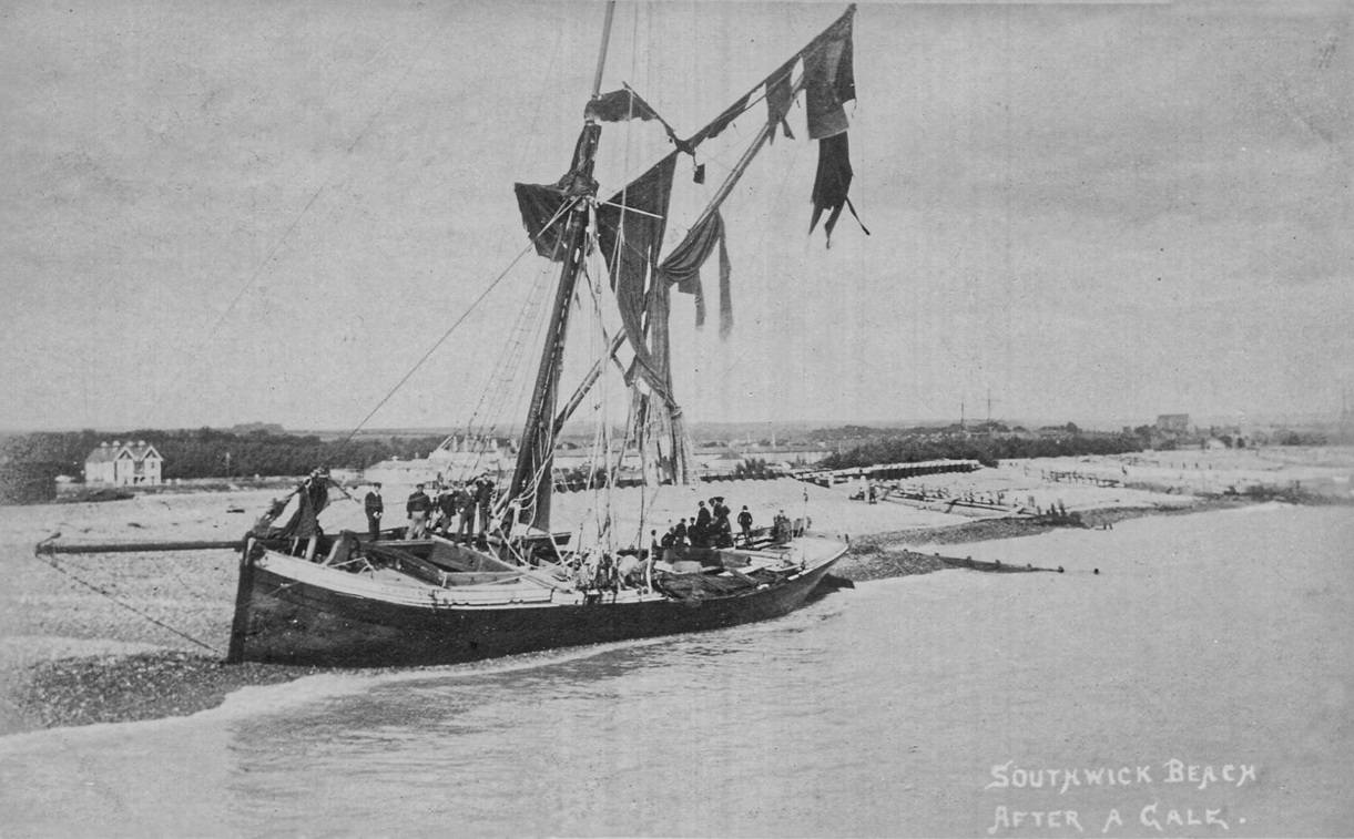 Beached sailing barge at Southwick Beach West Sussex